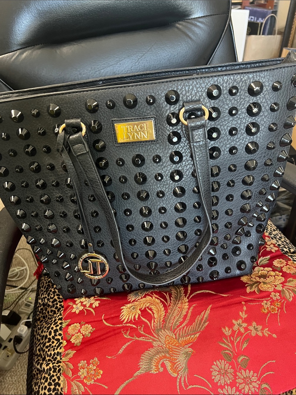 Traci Lynn Black Studded Tote with Gold Logo Accent